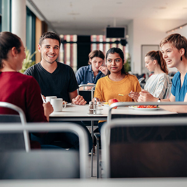 People Sitting at a table and talking