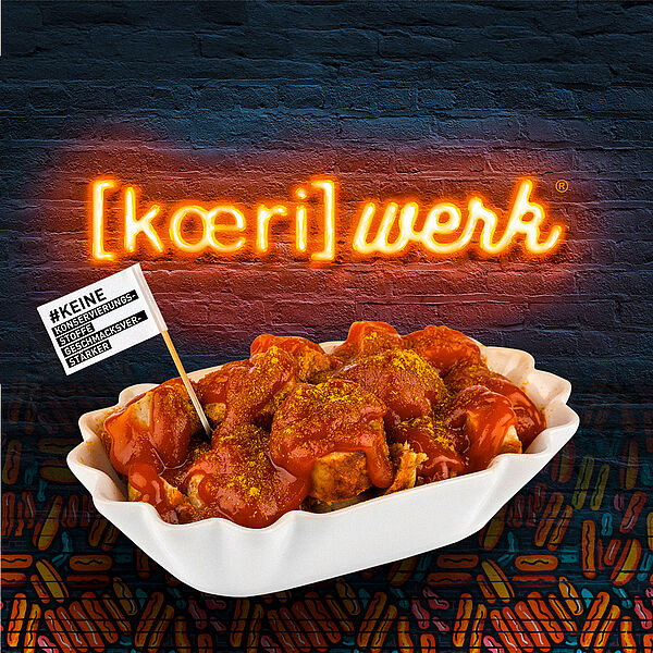 Picture of a currywurst with koeriwerk logo