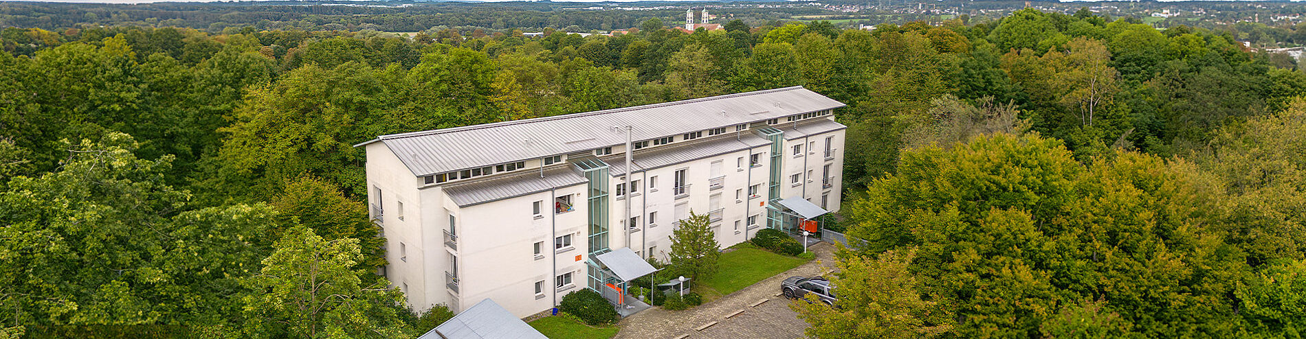 Aerial view of the Weingartshof residential complex in the forest